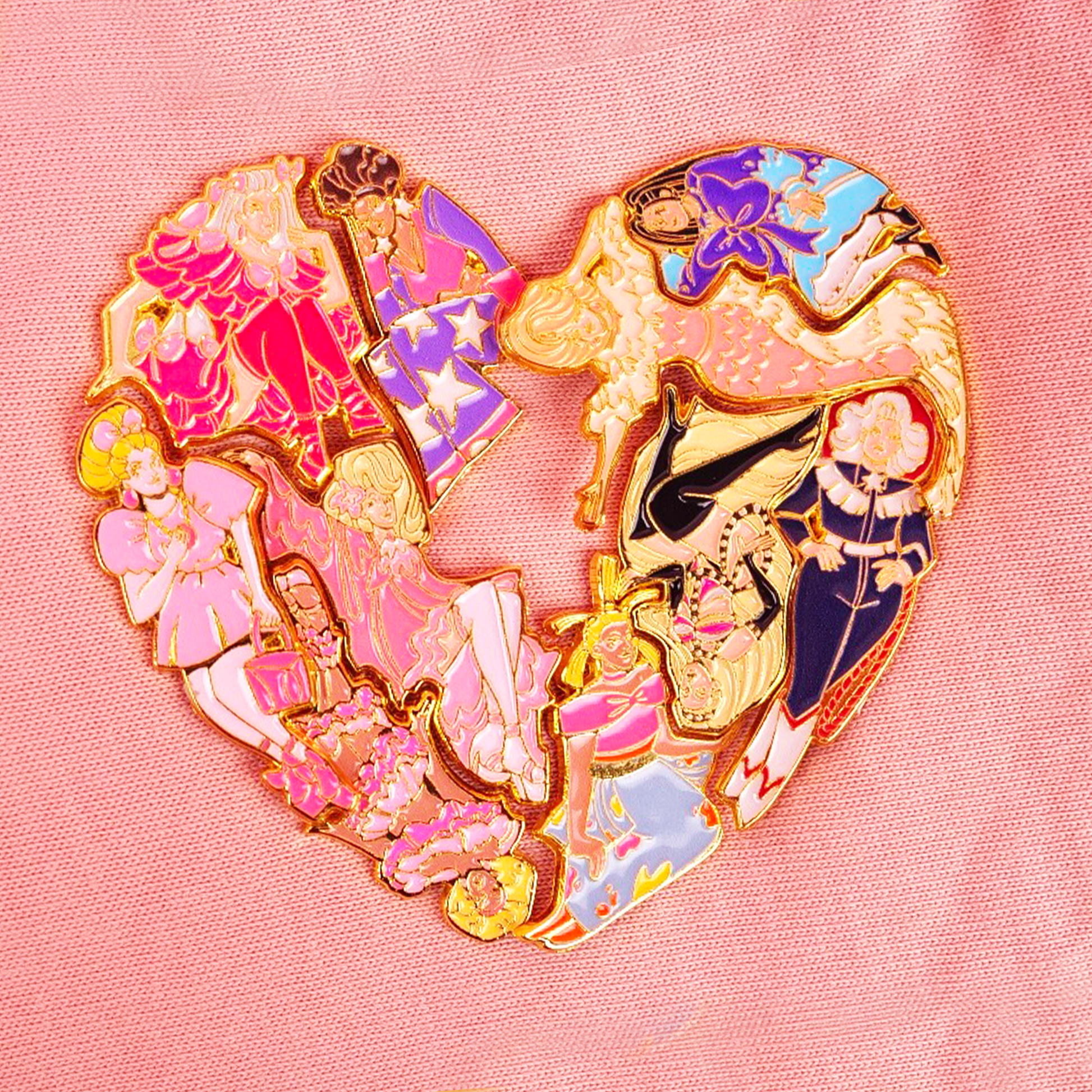 All the season 4 queens pins together on a salmon pink knit fabric, forming a love heart with the number 4 cut out of the centre. 